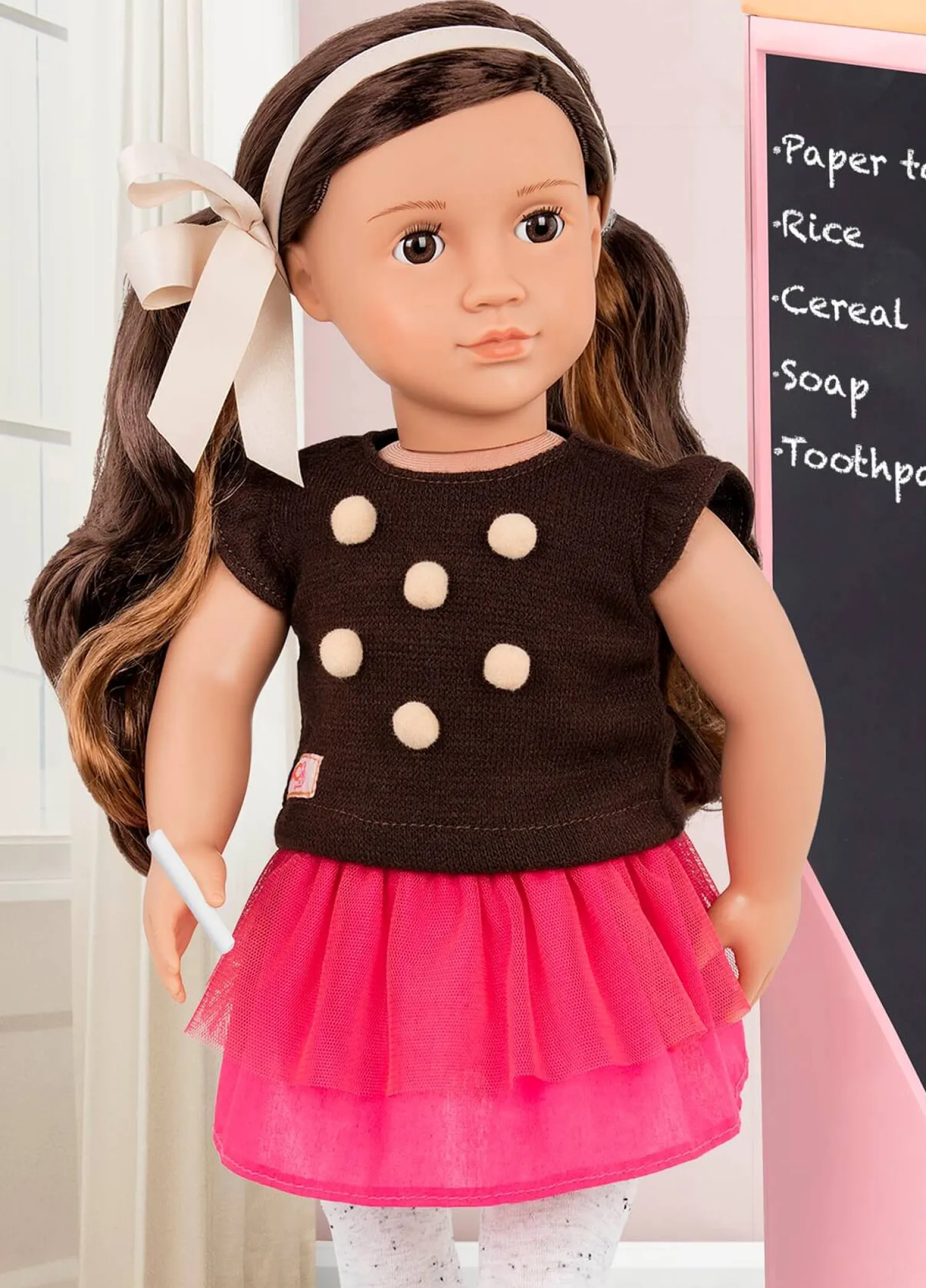 OurGeneration Lalka AVIA 46cm - Brunetka w bluzce z pomponikami