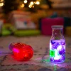 Glo Pals Postać do kąpieli edycja świąteczna - zestaw z dwiema kostkami sensorycznymi świecącymi w wodzie