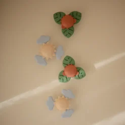 Mushie Spinner sensoryczny z przyssawką - Dino